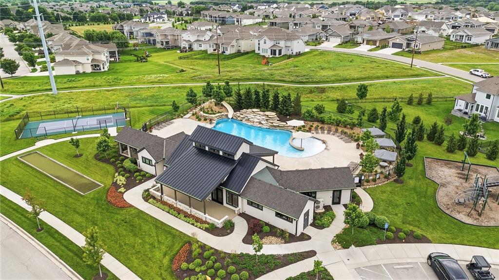 Mission Ranch community swimming pool with lounge seating on the surrounding deck under a clear sky