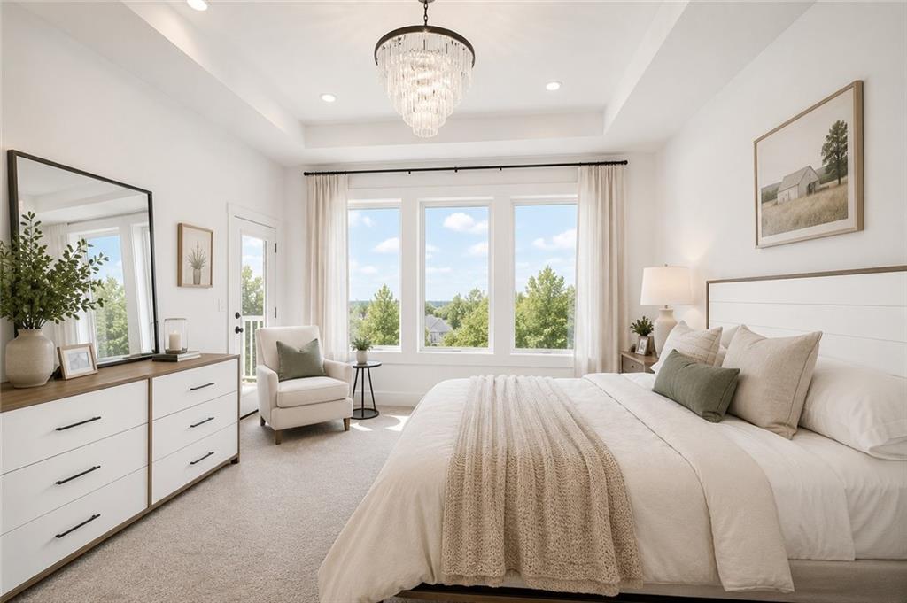 Primary bedroom with a tiered glass chandelier, a king bed in neutral linens, a private balcony door, and windows framing treetop views